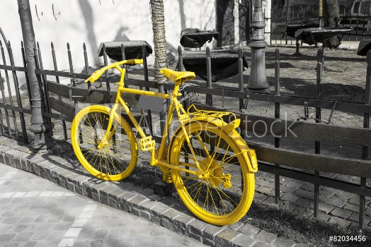 Picture of Yellow bicycle on the gray background